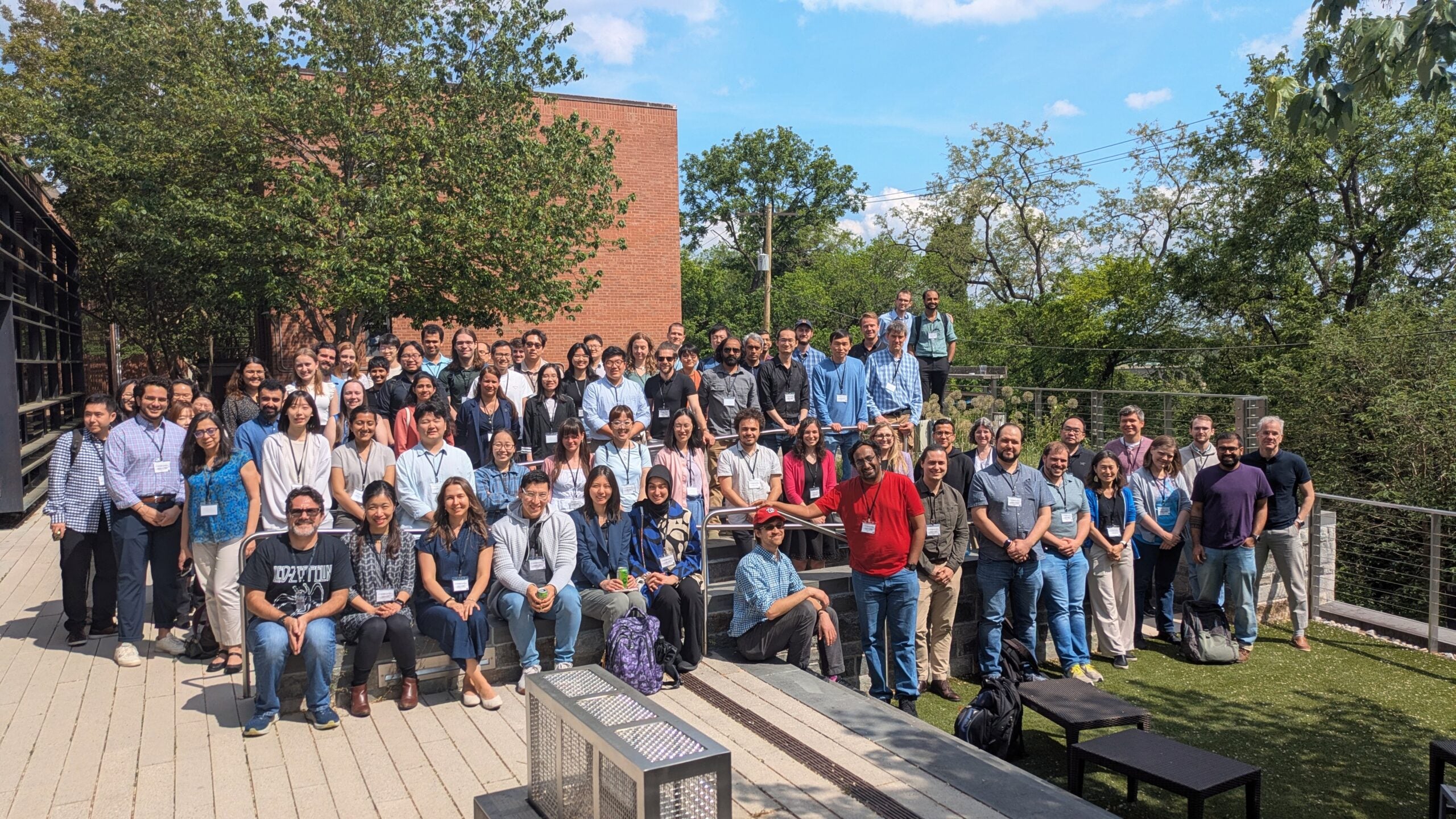 Large group of event attendees outside. 