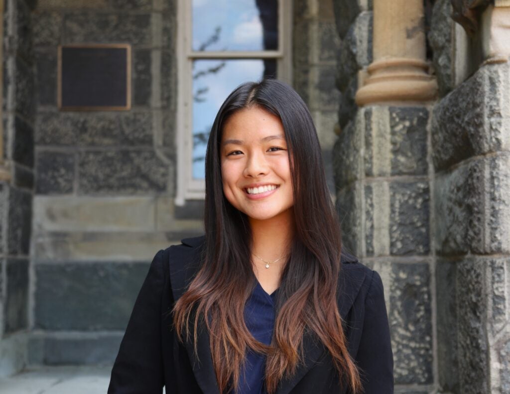 Leah Chen headshot in front of Healey Hall