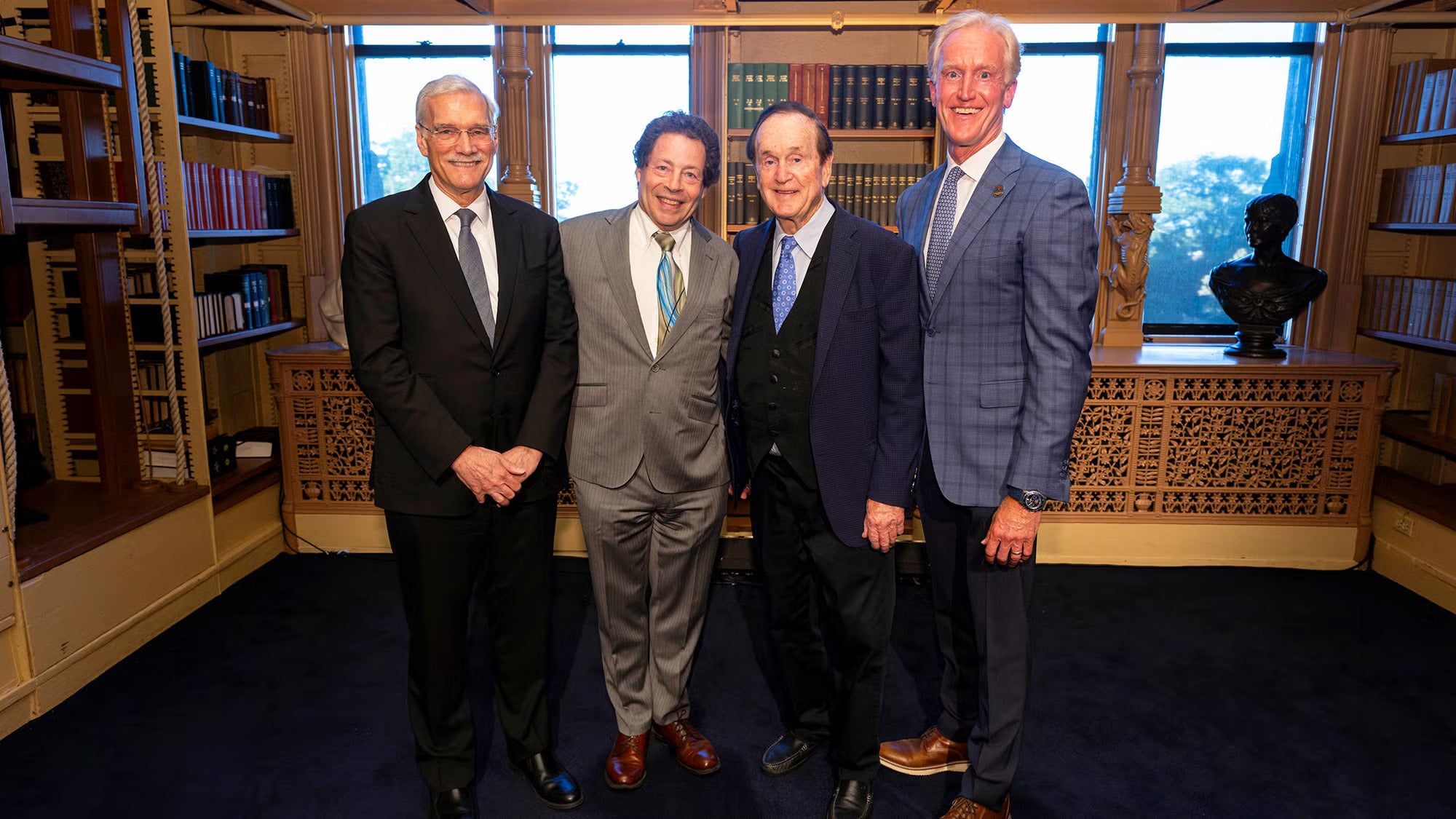 (Pictured from right) Kevin Reilly (B'91, P'26, P'27), vice chair of the Hyundai Hope on Wheels board of directors, and his father, Don, founder of the charitable organization, stand with the inaugural holder of the Hyundai Hope on Wheels Endowed Chair in Pediatric Oncology, Jeffrey A. Toretsky, MD, and Georgetown Interim President Robert M. Groves, PhD.