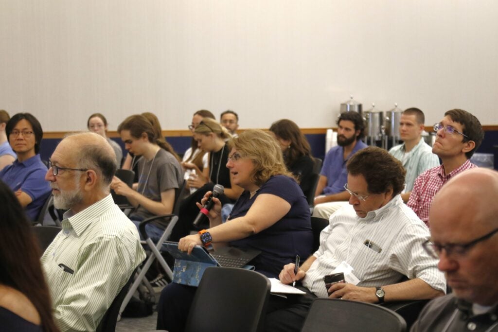 Woman in audience asking question with the mic